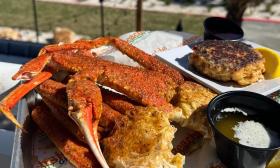 Bairdi Crab Legs, are served with garlic butter and Old Bay seasoning at Crabby's