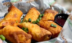 This house-made eggroll appetizer from Crabby's is made with avocado, cream cheese, and peppers