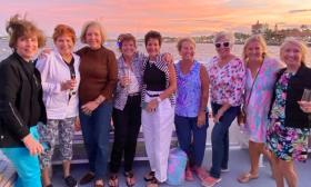 This group of seven friends are enjoying a sunset cruise aboad the Pellicano of Red Boat Tours