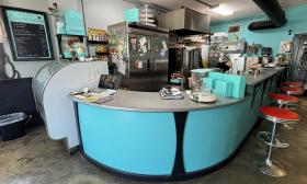 The counter area with stools lining the side