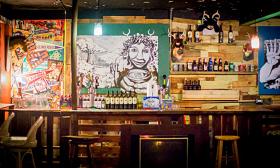 The bar at Sarbez displays local artwork. 