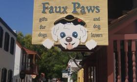 The exterior sign for Faux Paws as seen on St. George Street