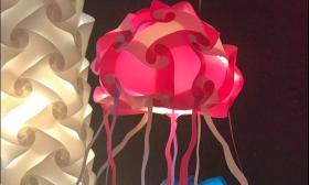 A pink jellyfish lamp hanging inside the shop
