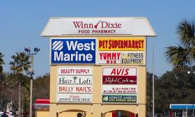 Winn-Dixie shopping center sign with businesses listed below
