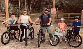 A family enjoys a day bicycling in the great outdoors