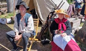 A couple sitting at their tent in the School for 16th Century encampment