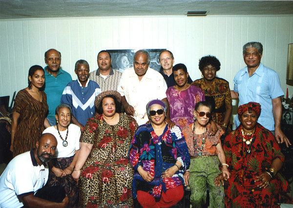 A group of older Black people, all veterans of the US Civil Rights Movement, pose for a picture during their reunion. Dr. R.B. Hayling is seen in a blue shirt on the right side of the picture.