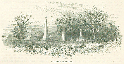 A black and white illustration of a cemetery in St. Augustine, Florida. Several obelisks tower above an iron fence, surrounded by scraggly trees. Two coquina pyramids on the left honor US "victims" of the Seminole War.