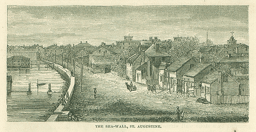 A black and white print of the city and sea wall of St. Augustine, Florida. It is an aerial view of the colonial architecture with a few figures in the dirt road. A few boats and buoys float in the bay, which is on the left side of the image. A few people also walk along the sea wall.