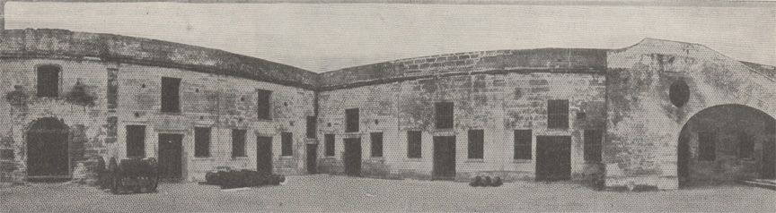 A black and white panoramic image of the interior walls of the Castillo de San Marcos in St. Augustine, Florida, circa 1915. This shows the east facing wall of the inner courtyard on the right side of the image and the north facing wall on the left side of the image..
