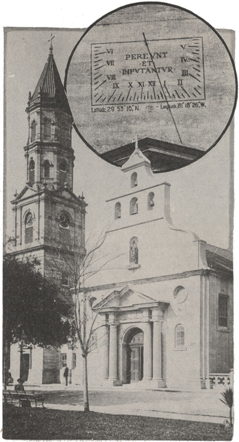 A black and white photograph of the Cathedral Basilica in St. Augustine, Florida. Its bell tower sit ands to the west of its main chapel. There is a graphic added to this image-- a circle frame that included a close up image of the Cathedral's sun dial, which reads the time the image was taken to have been around 12:30 pm.