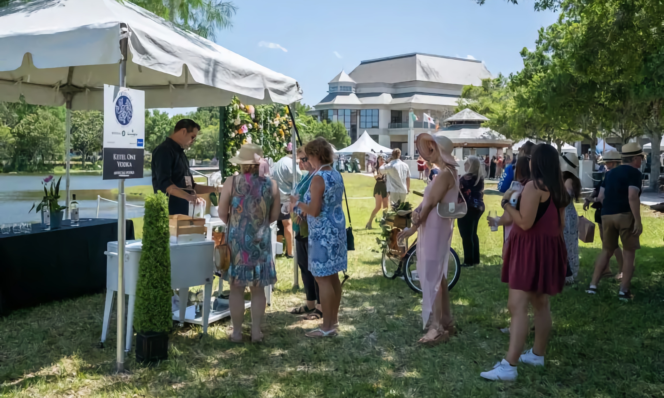 Guests enjoying the Main Event of the St. Augustine Food + Wine Festival, outdoor on a sunny day in St. Augustine