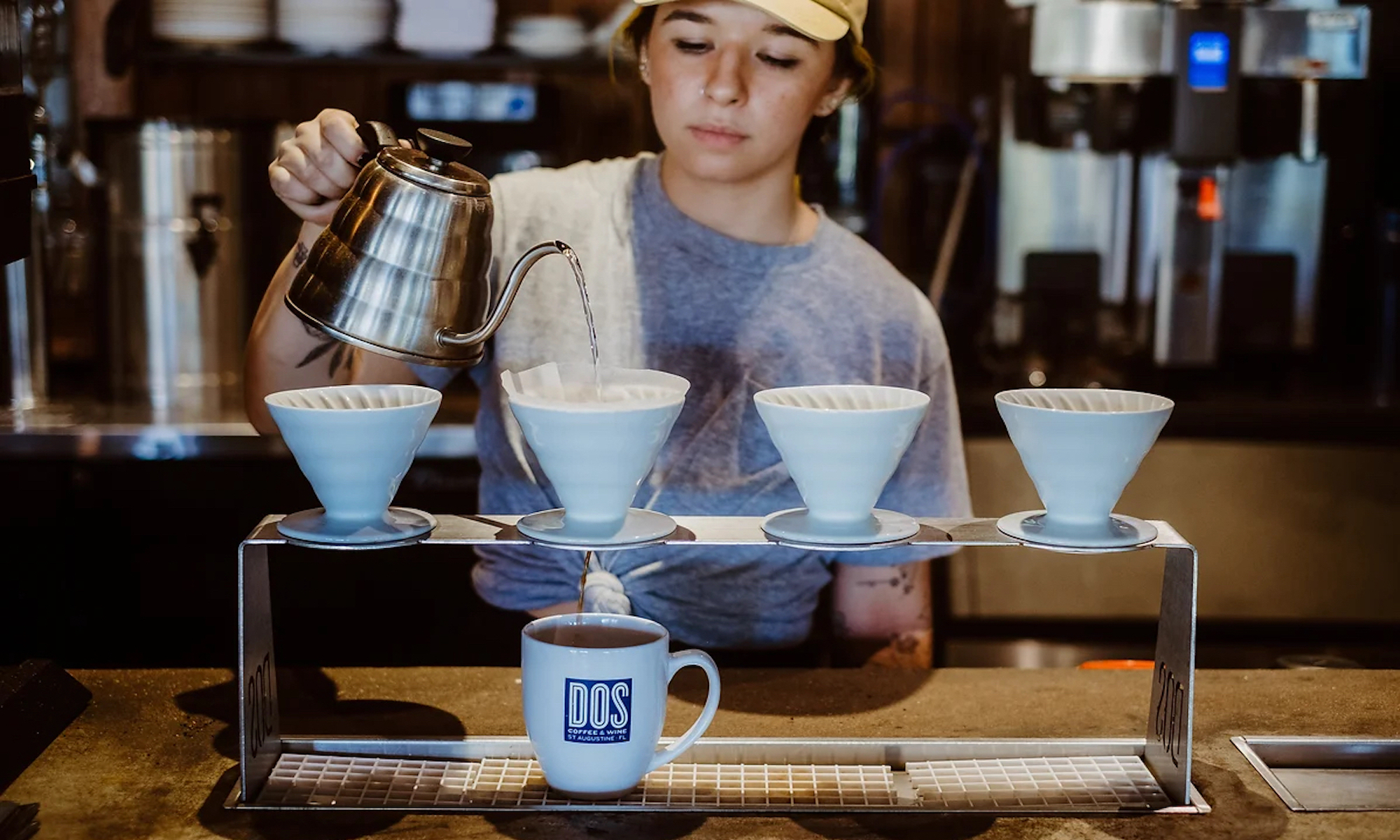 A barista at DOS Coffee