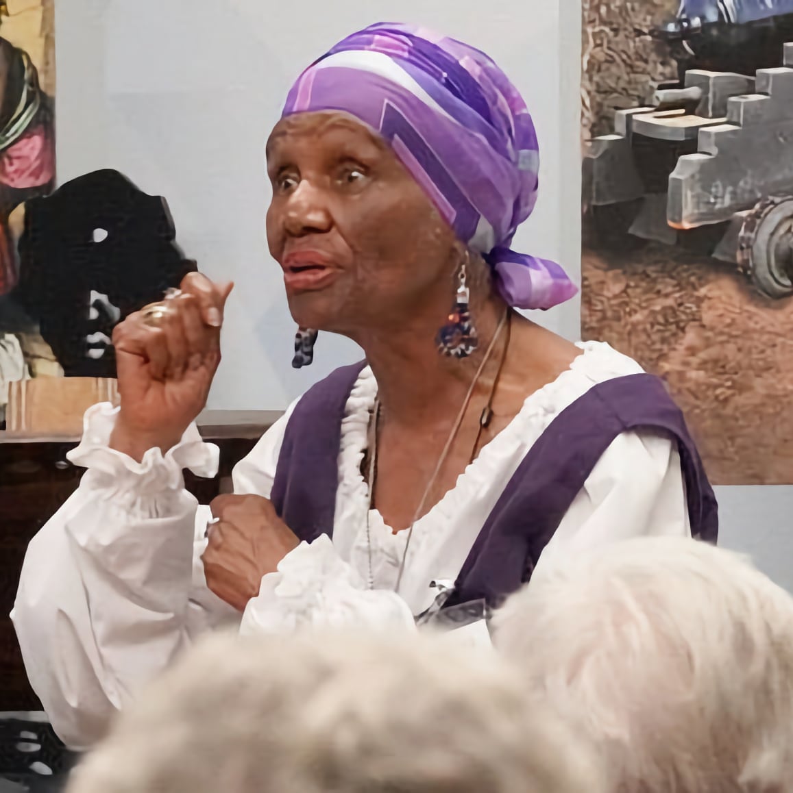 Dr. Deeh Israel, dressed in historic garb, speaks to a group at Fort Mose in St. Augustine