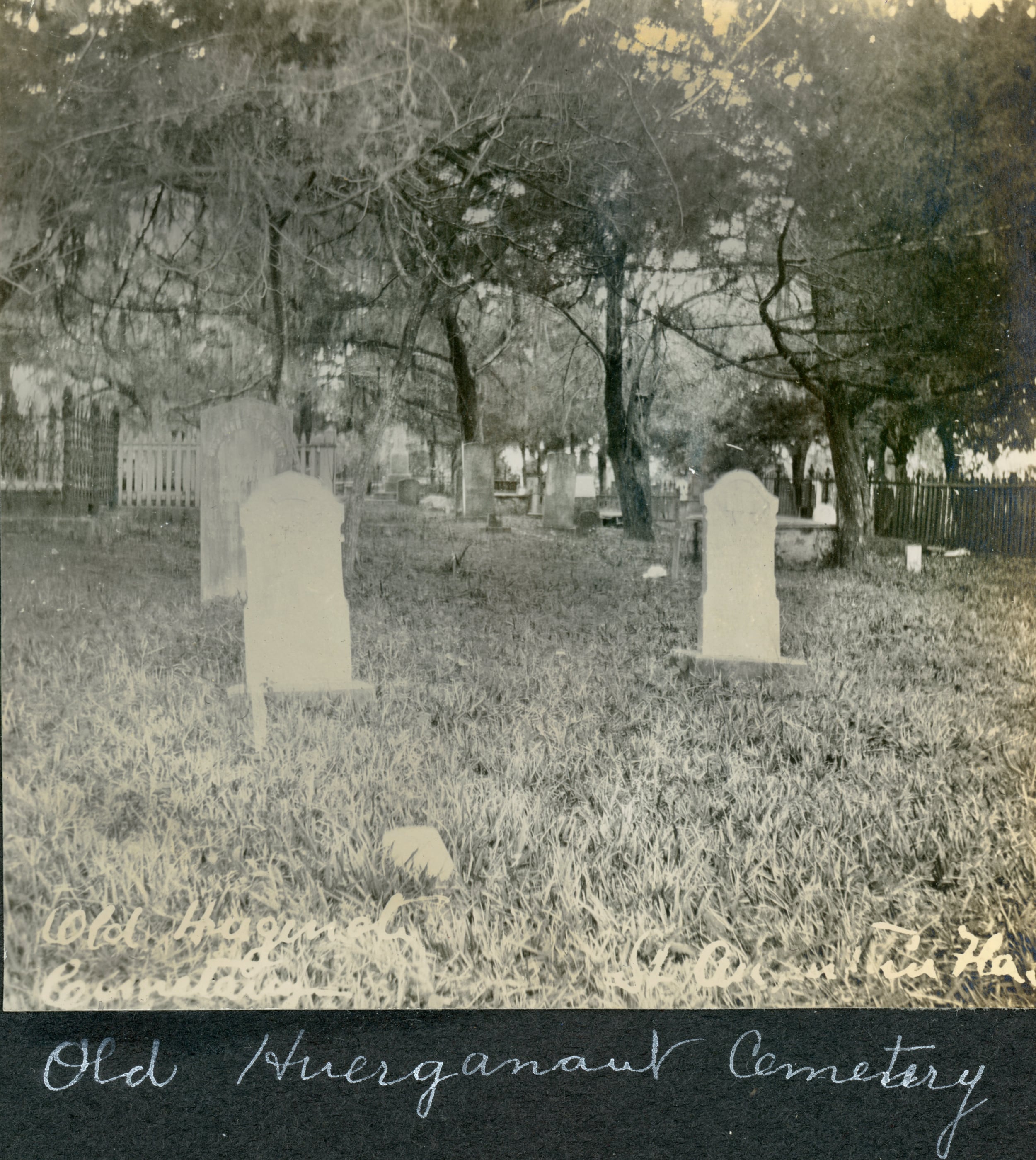 A black and white historical photo of the Huguenot Cemetery's headstones in St. Augustine, Florida