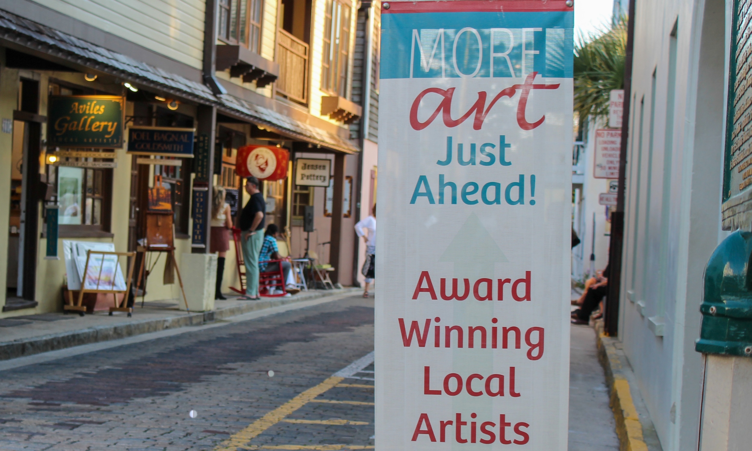 Aviles Street and the sign inviting visitors to explore all the galleries on First Friday Art Walk