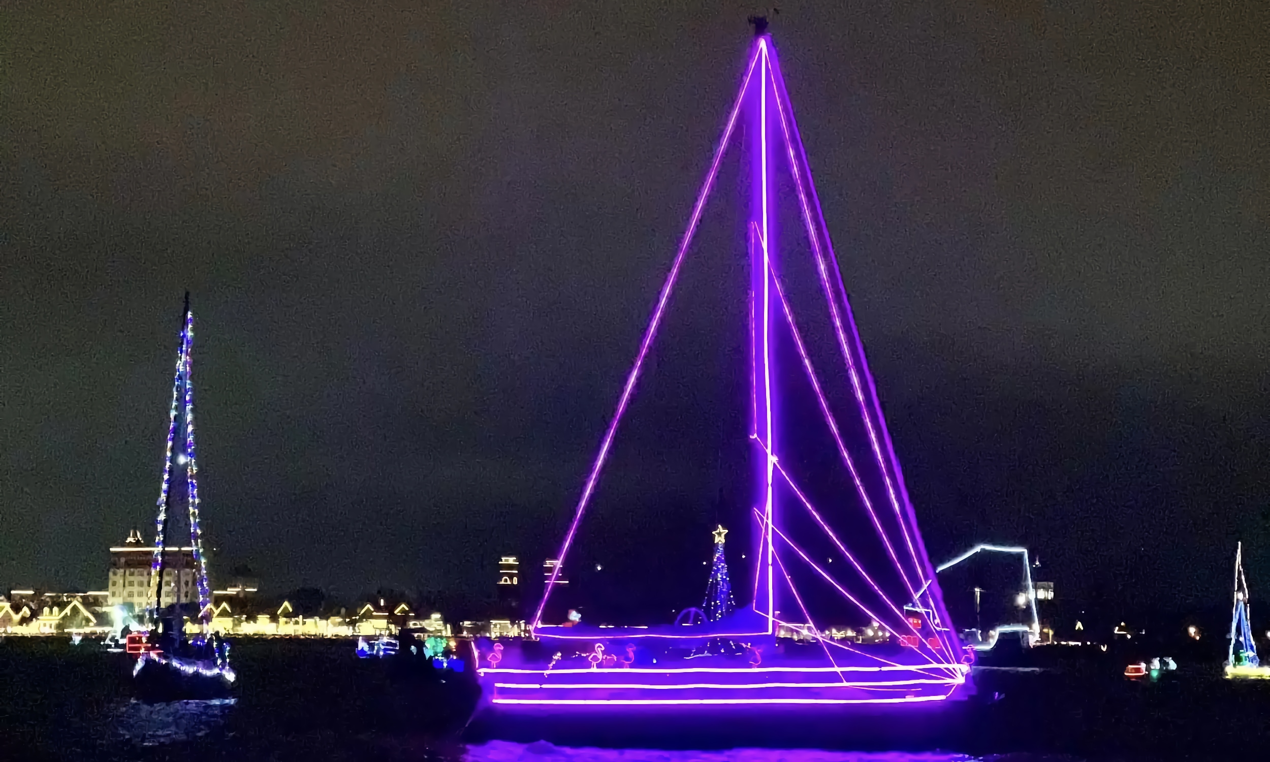 Sailboats, light with lights for St. Augustine's Regatta of Lights on the Bayfront