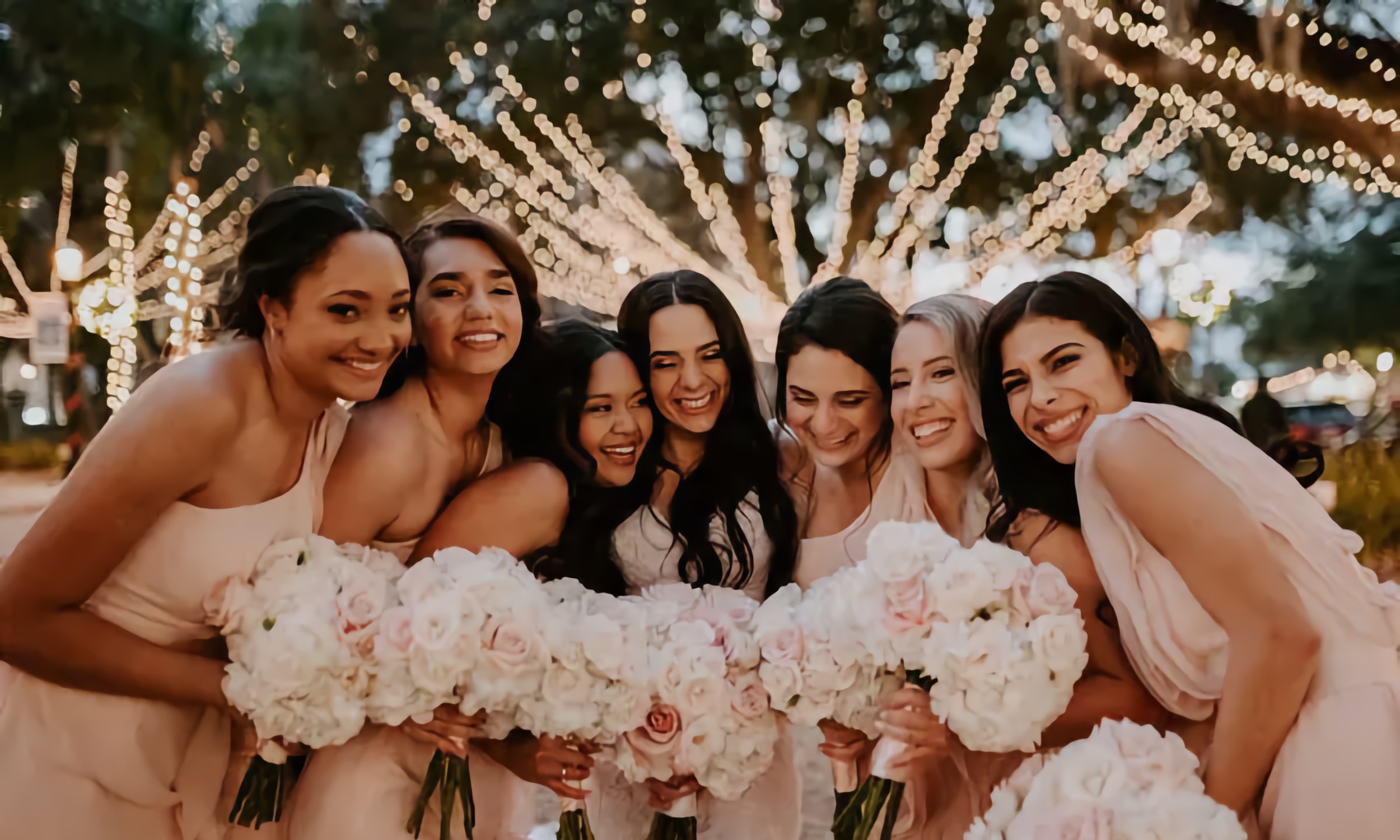 A group of bridesmaids in the Plaza during the Nights of Lights celebration