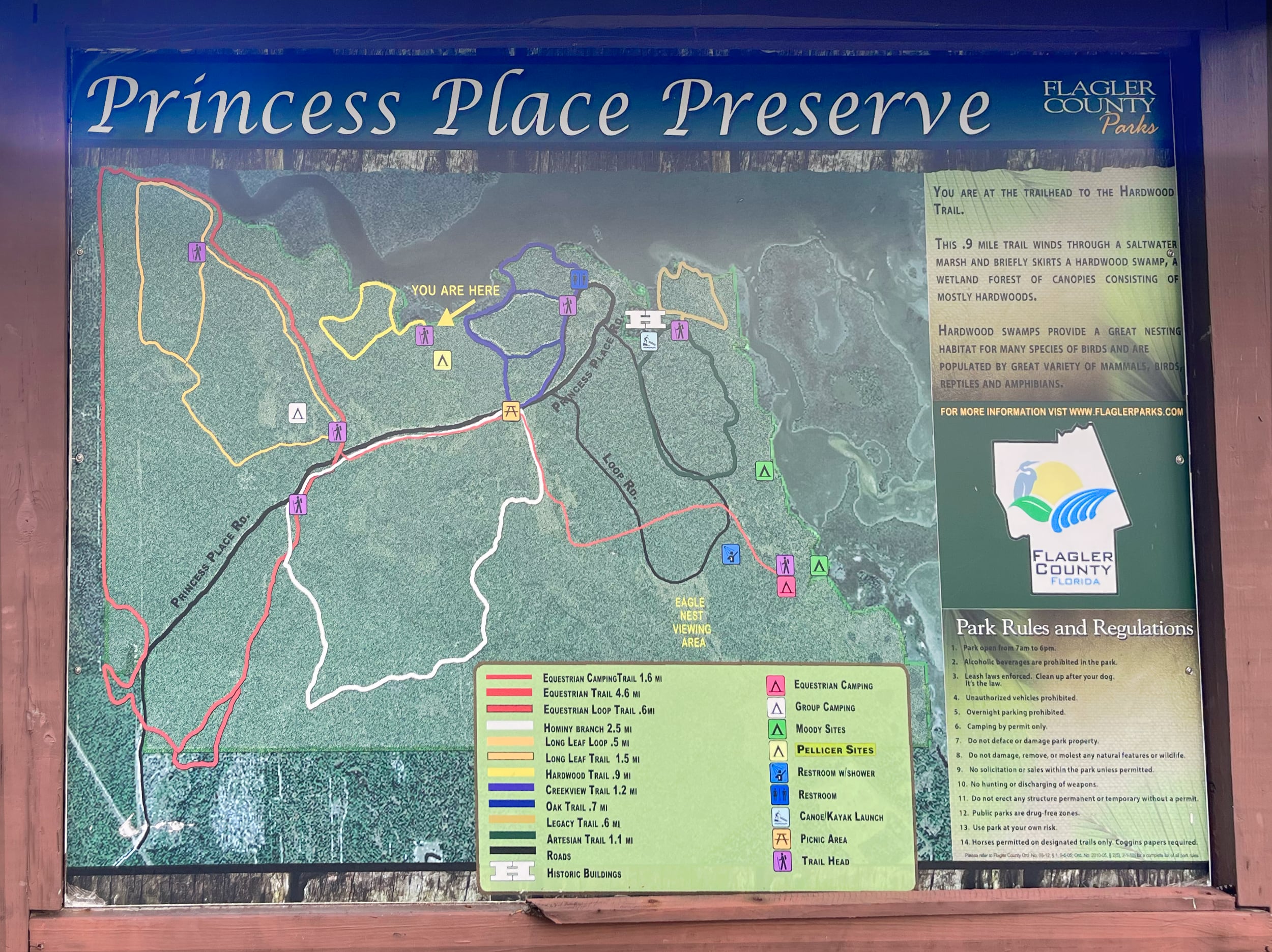 A sign showing the color coded trail system at Princess Place Preserve.