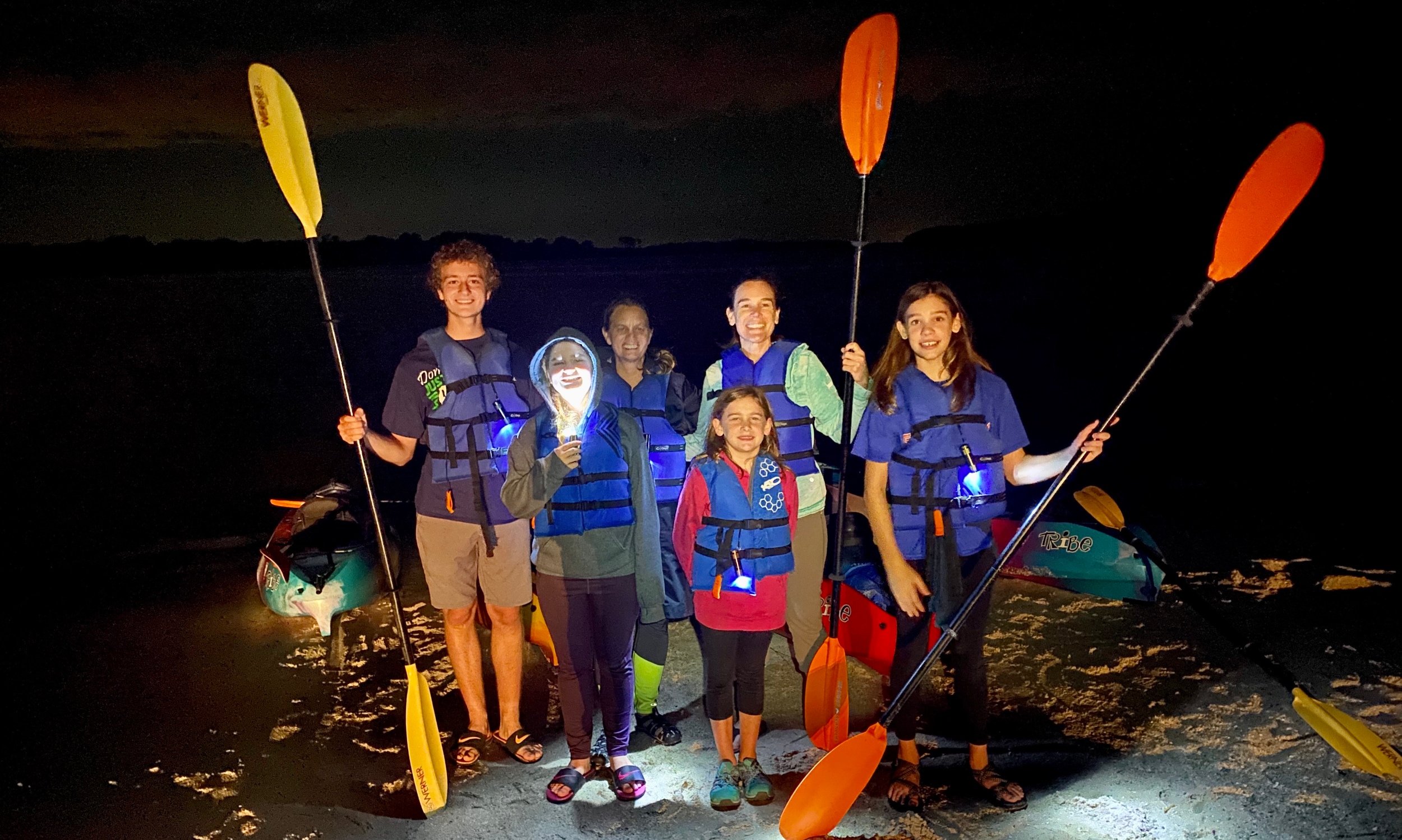 A family group prepared for a Geo Trippin' bioluminescent tour