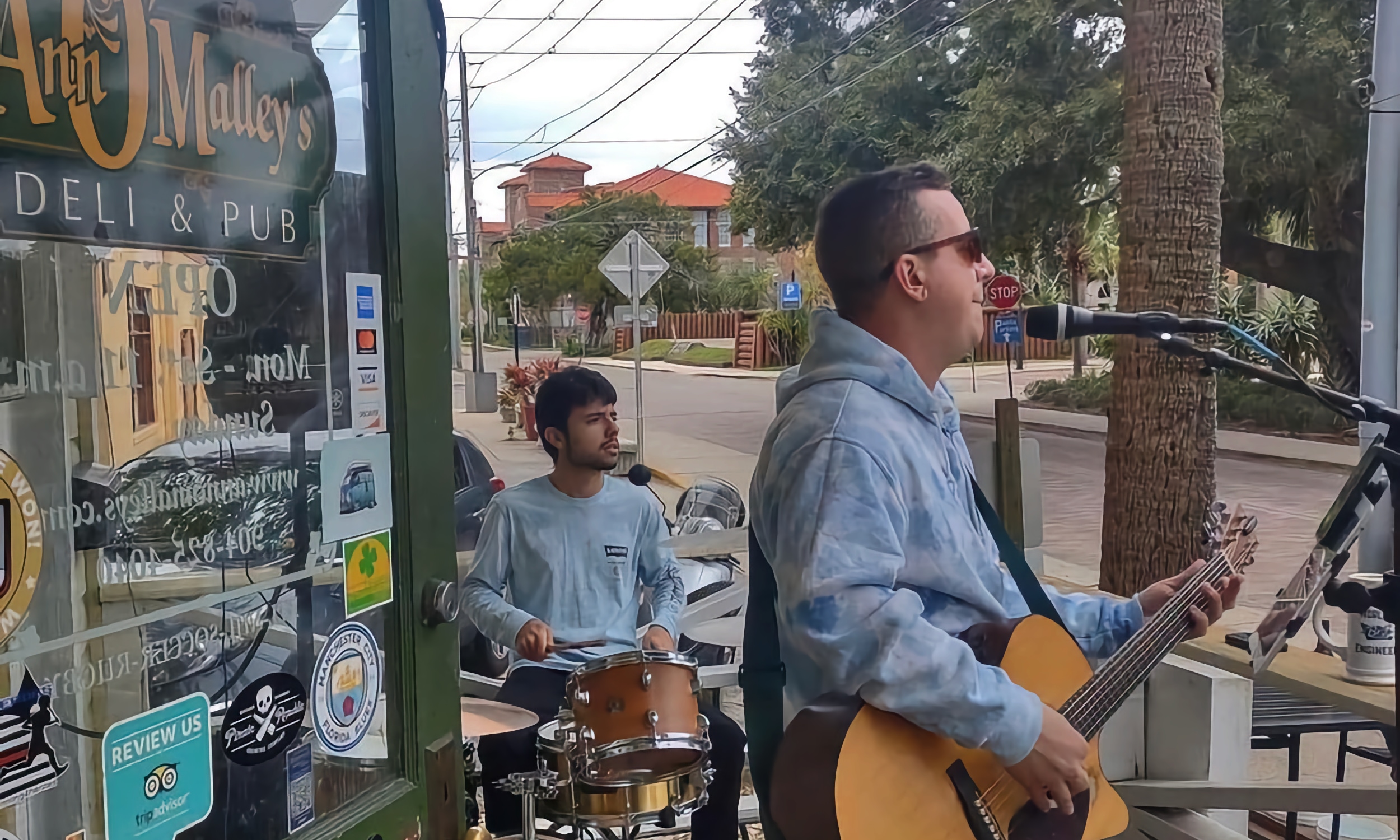 Velvet 45 with Ian Opalinski at the mic, playing music on Ann O'Malley's porch