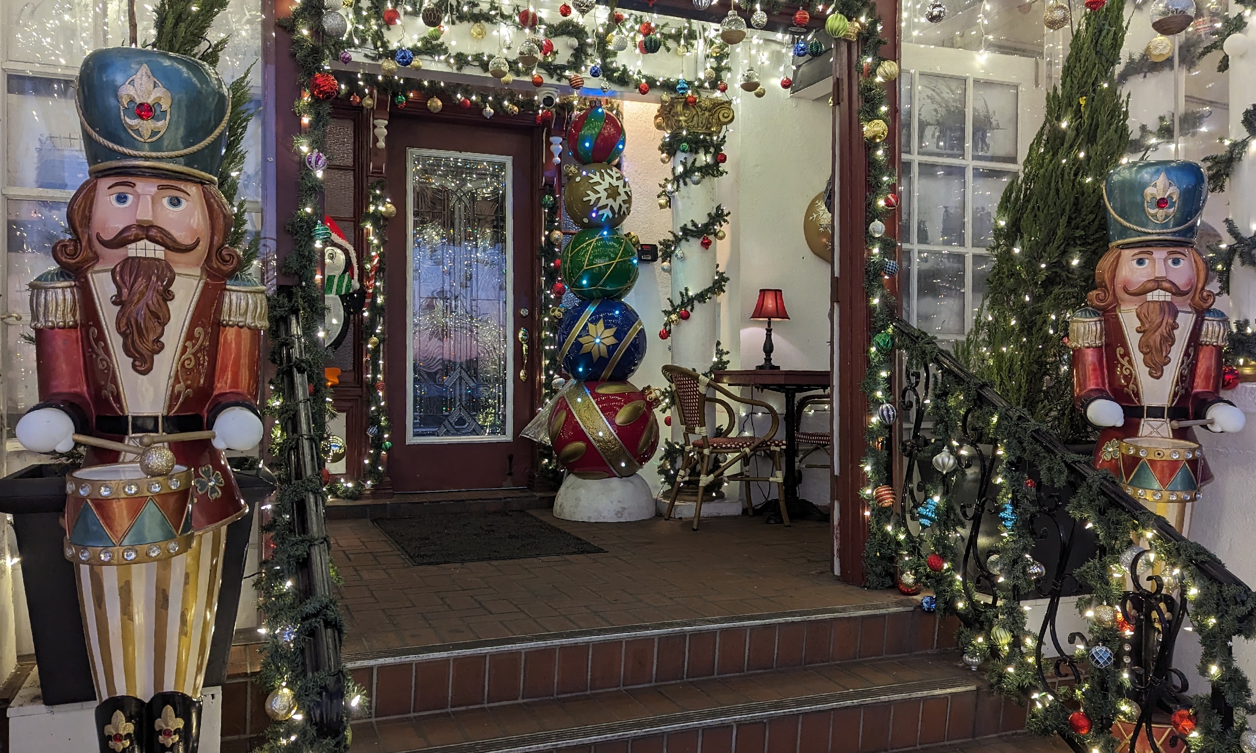 Twin statutes of holiday drummers flank the steps to the Tini Martine bar during Nights of Lights