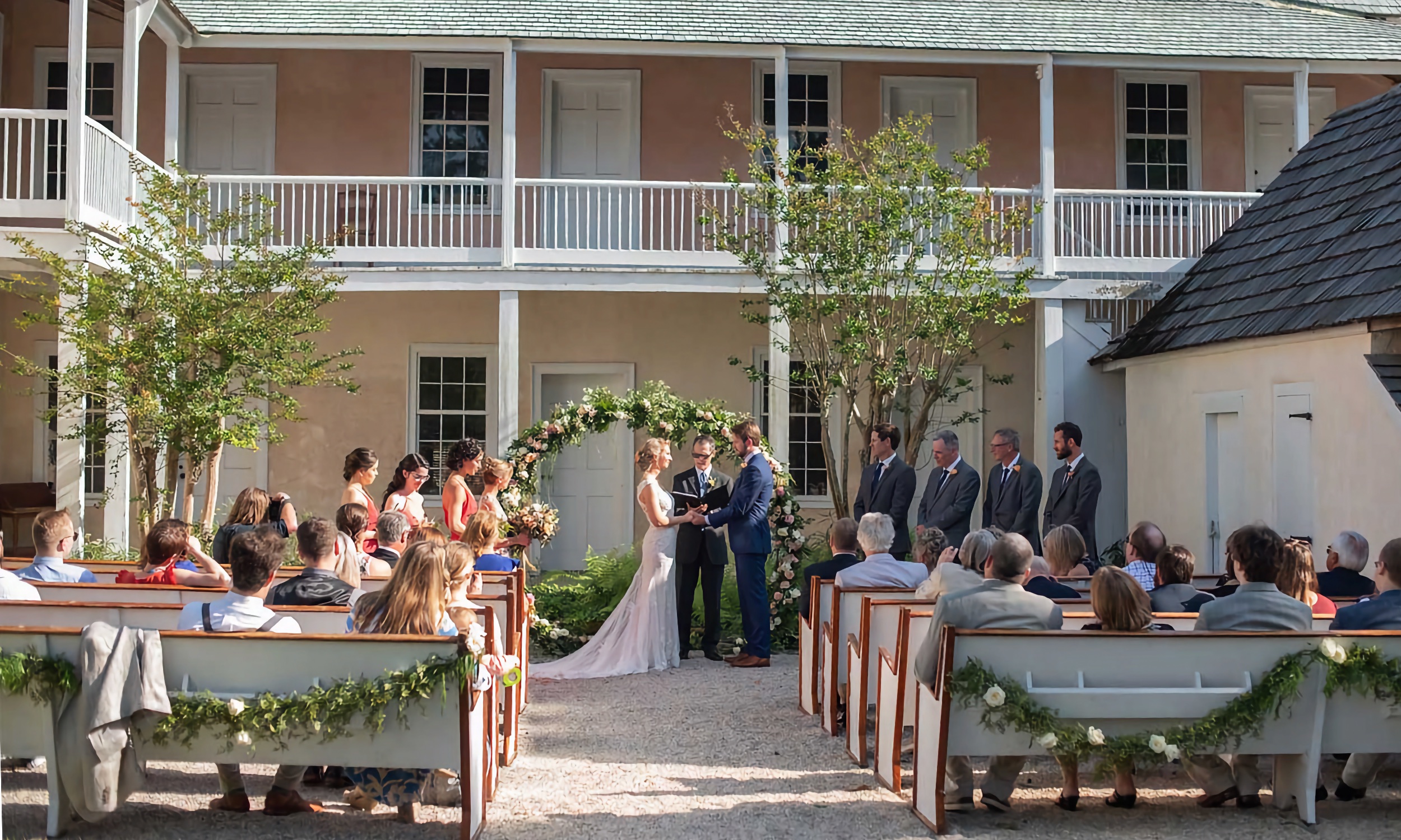 An outside wedding ceremony at the Ximenez-Fatio House Museum