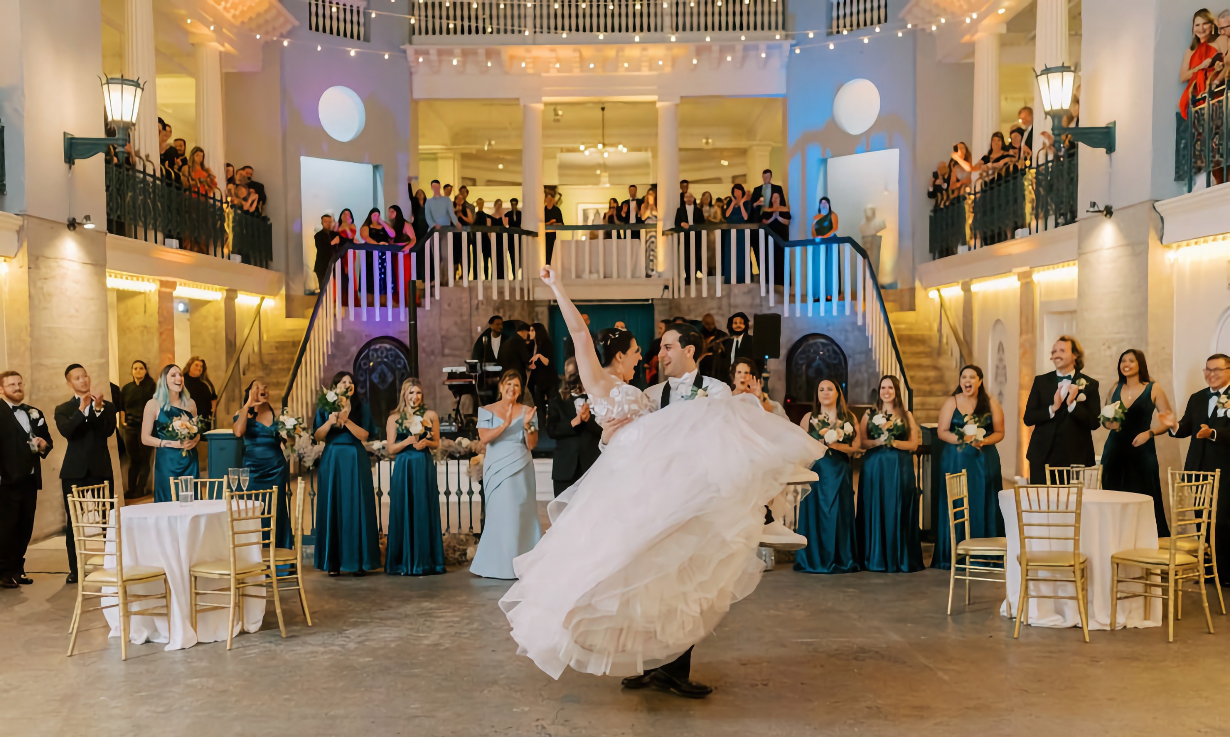 A married couple dancing at their wedding reception at the Lightner Museum
