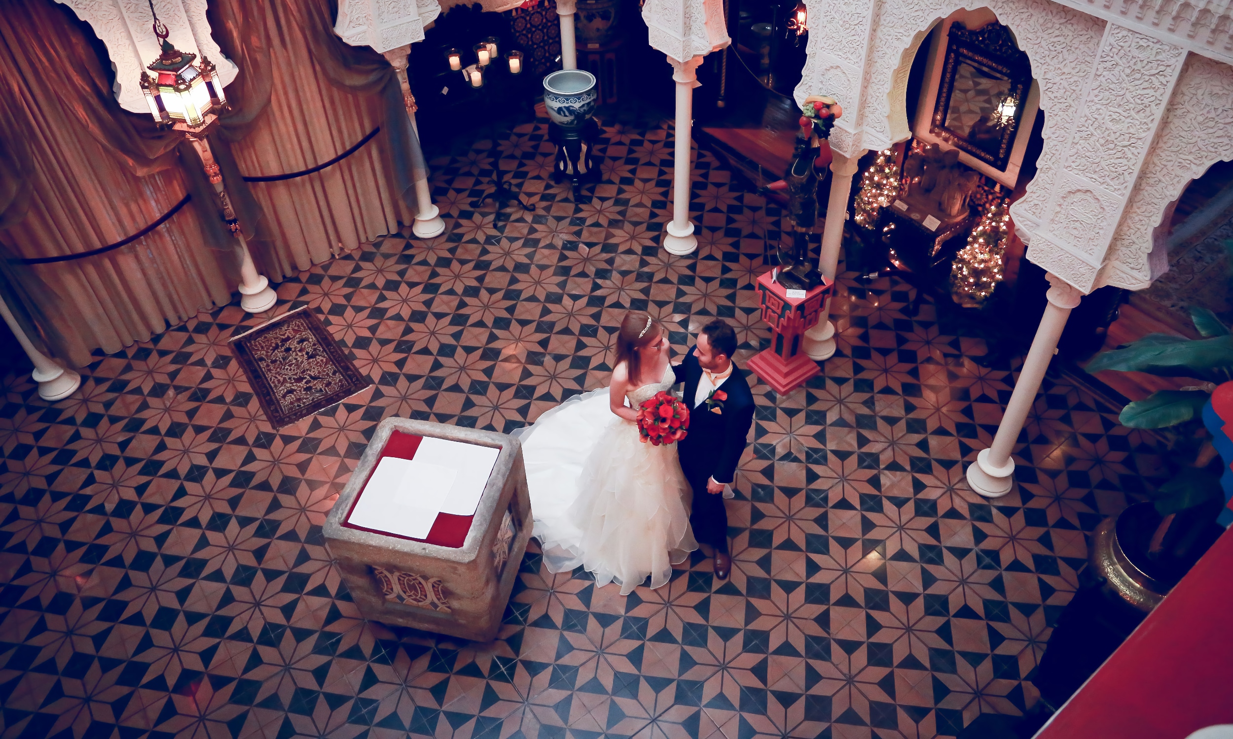 A couple standing in the center of the historical Villa Zorayda