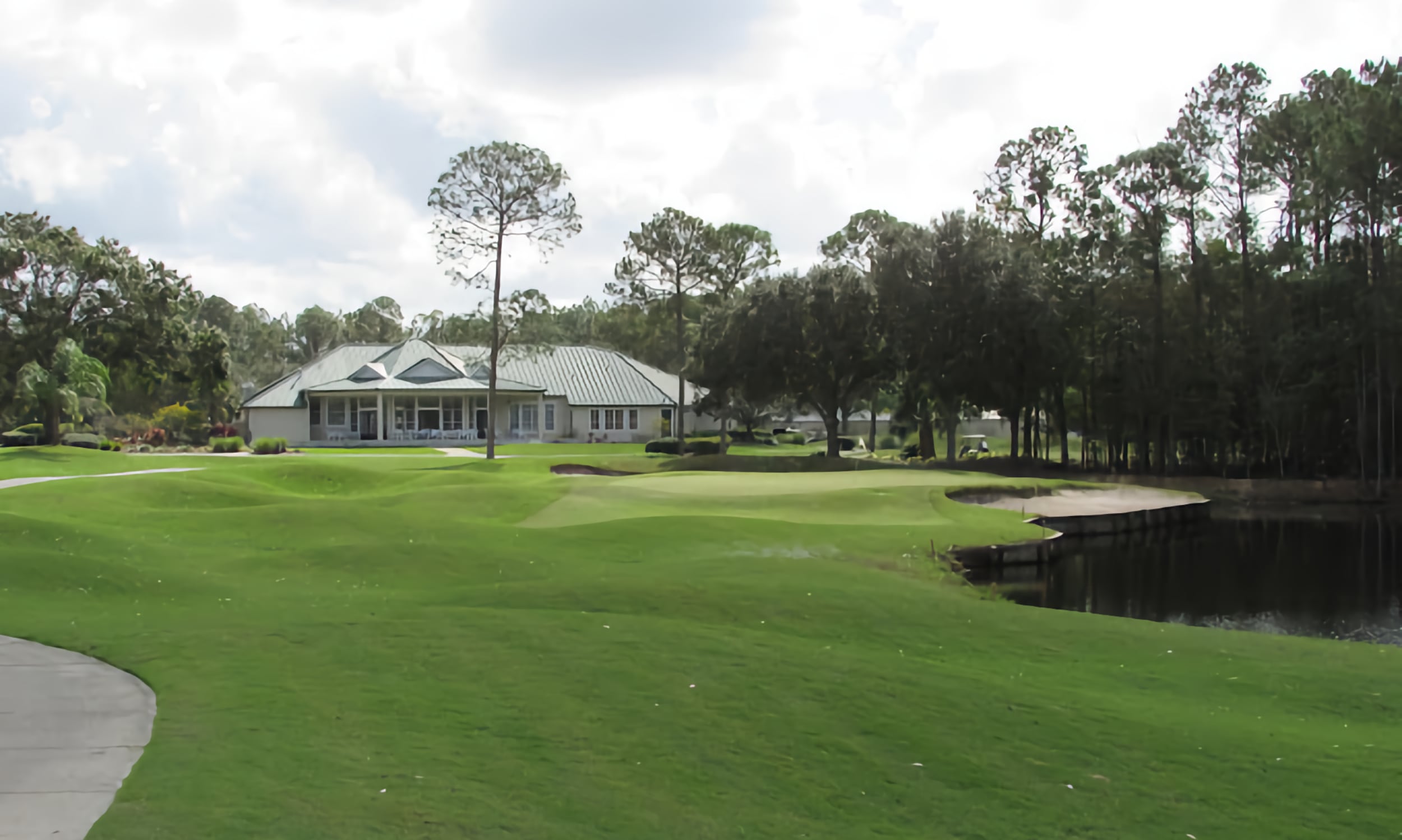 Cimarrone Golf Clubhouse overlooking undulating fairway and water hazards