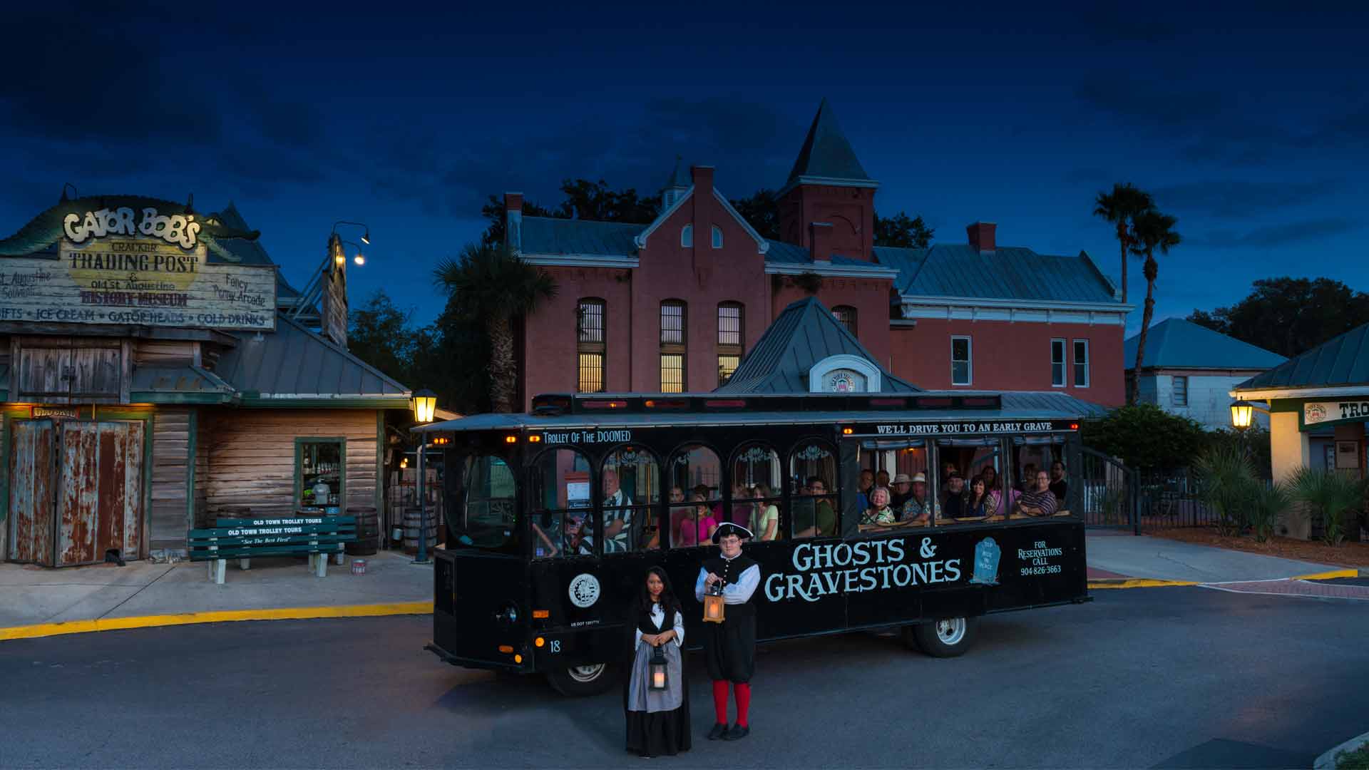 Ghost and Gravestones haunted trolley in front of the Old Jail