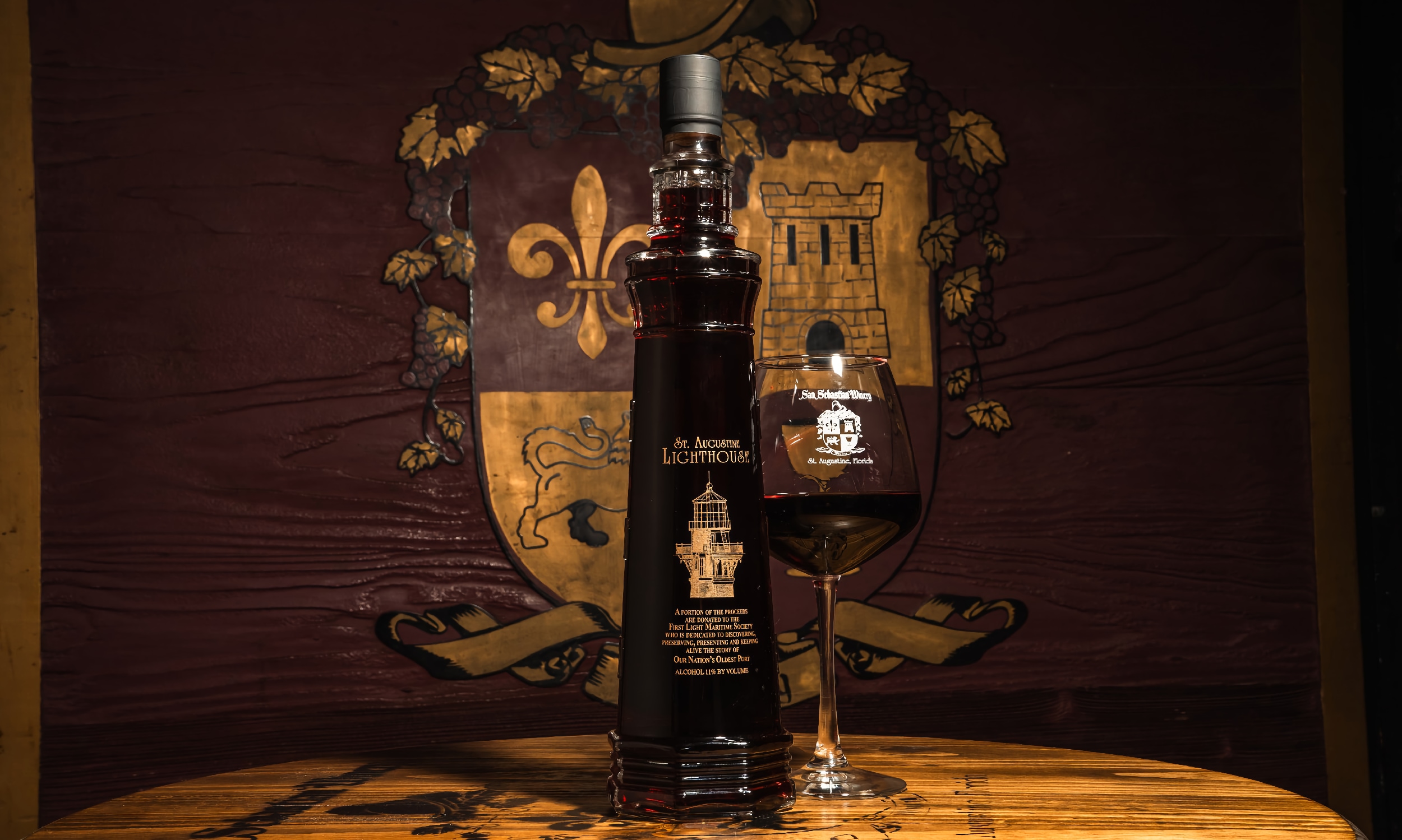 Red wine from San Sebastian Winery presented in a St. Augustine Lighthouse bottle
