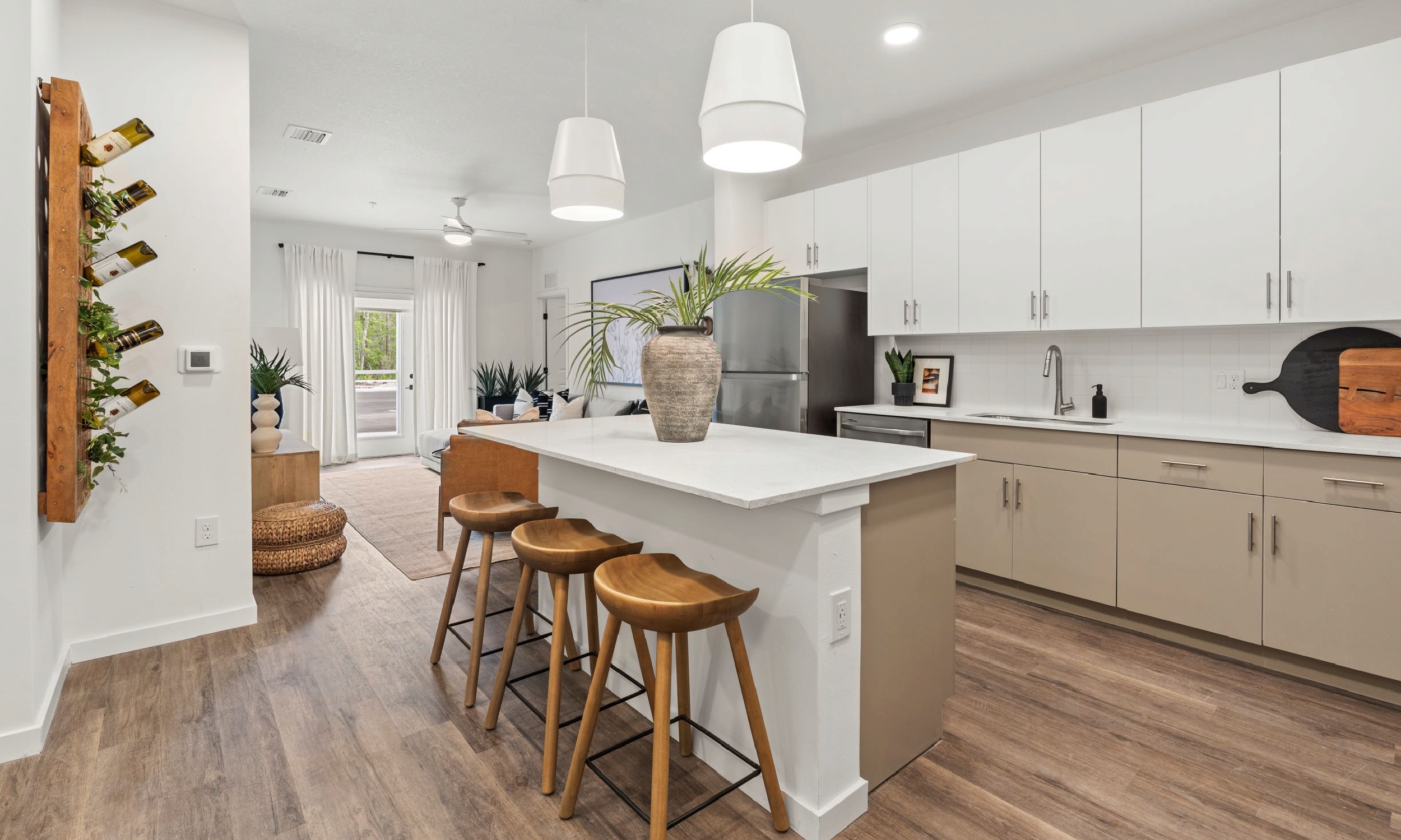 A view of an apartment kitchen from the entry door at Soluna Apartments