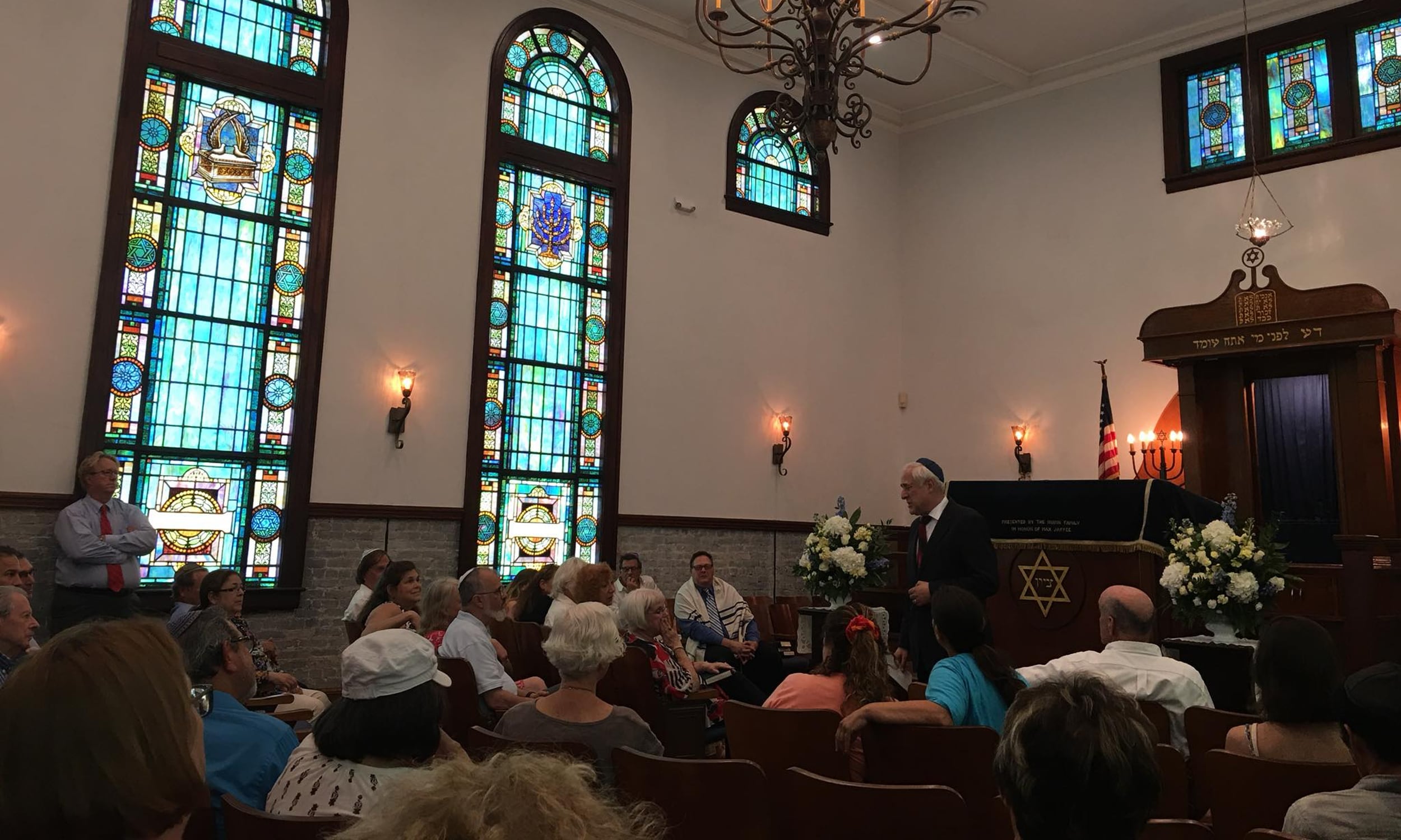 A rabbi talking to a crowd during First Congregation Sons of Israel worship service