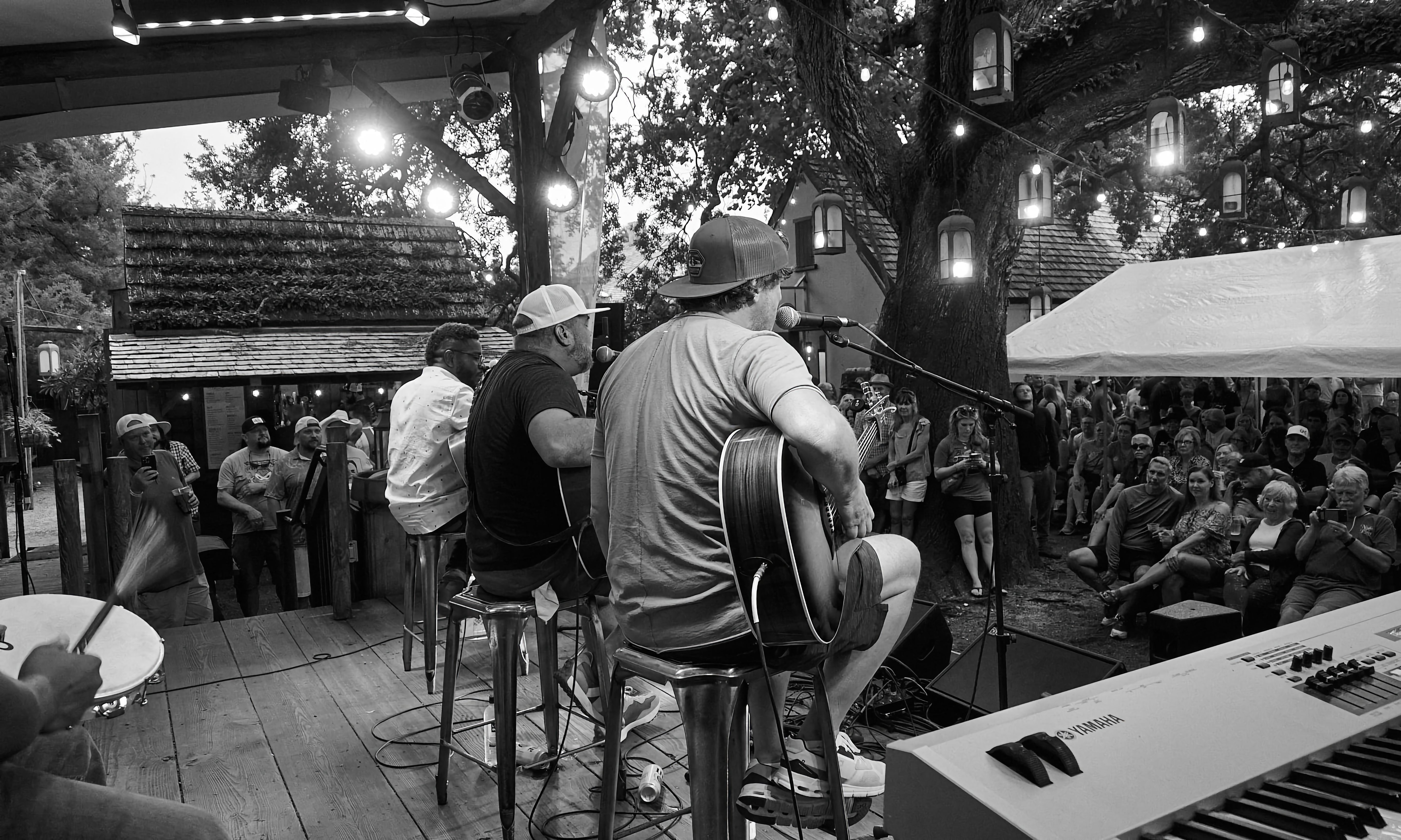 Three Nashville songwriters on stage at Colonial Oak Music Park for the Songwriters Festival