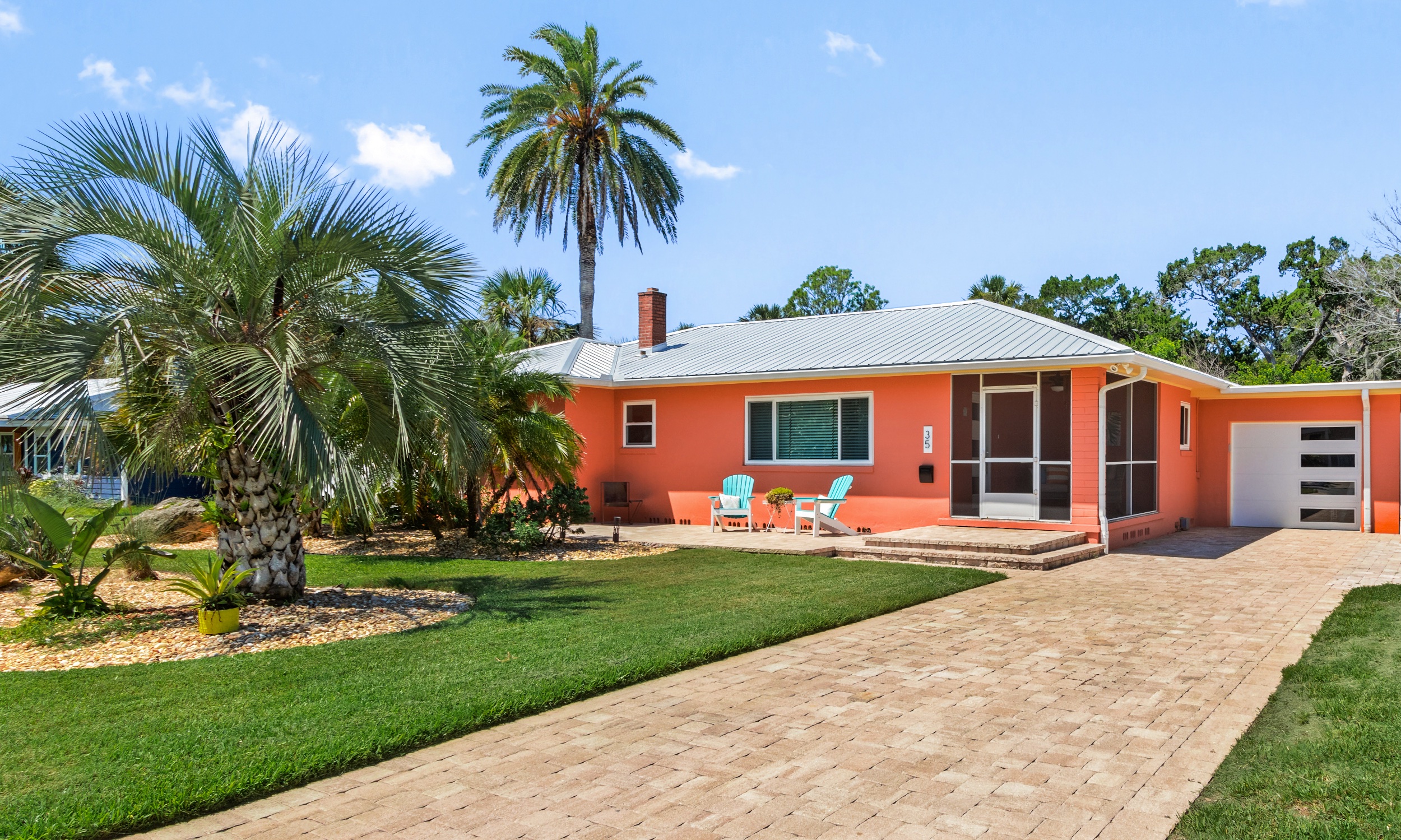 A ranch house in Florida, painted a bright coral
