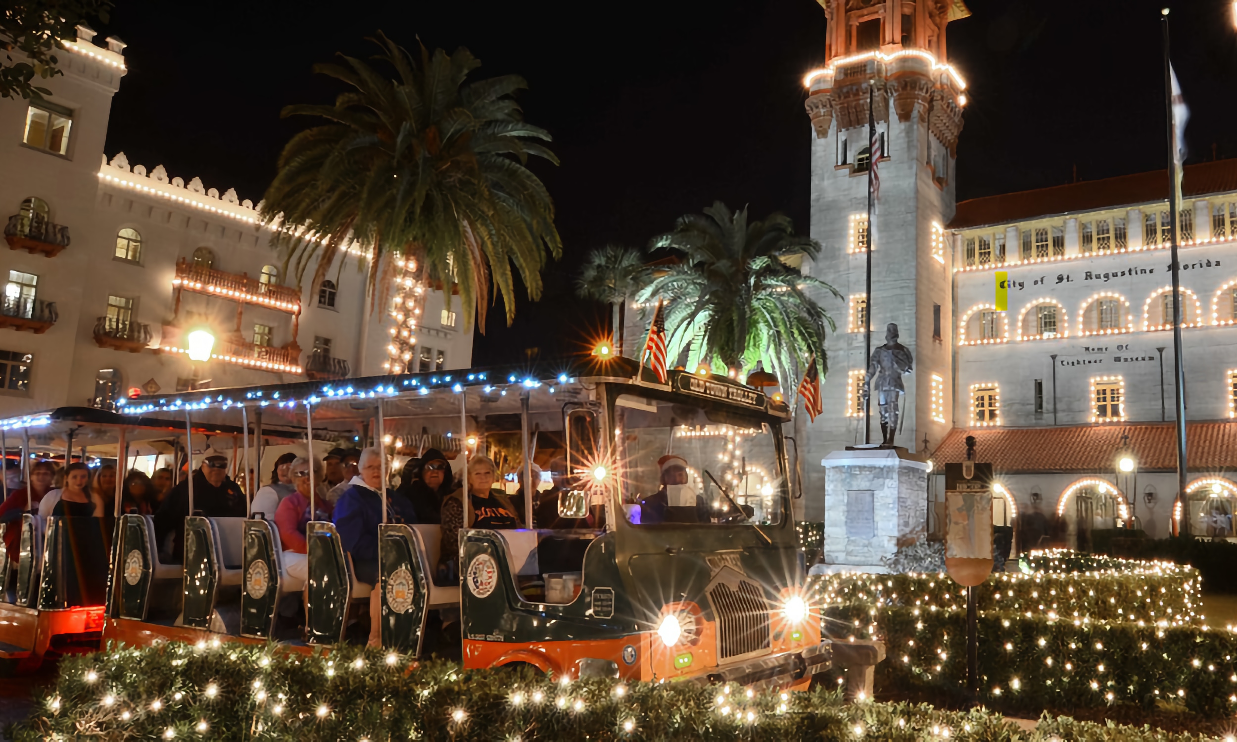 An Old Town Trolley, decorated for Nights of Lights in front of the Lightner