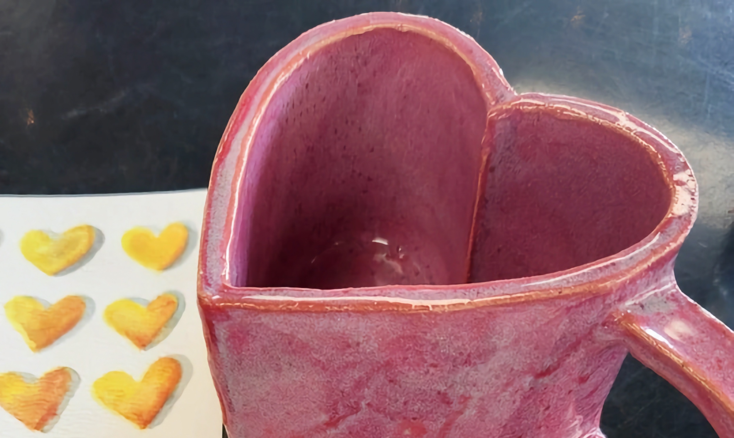 A heart-shaped mug made out of clay