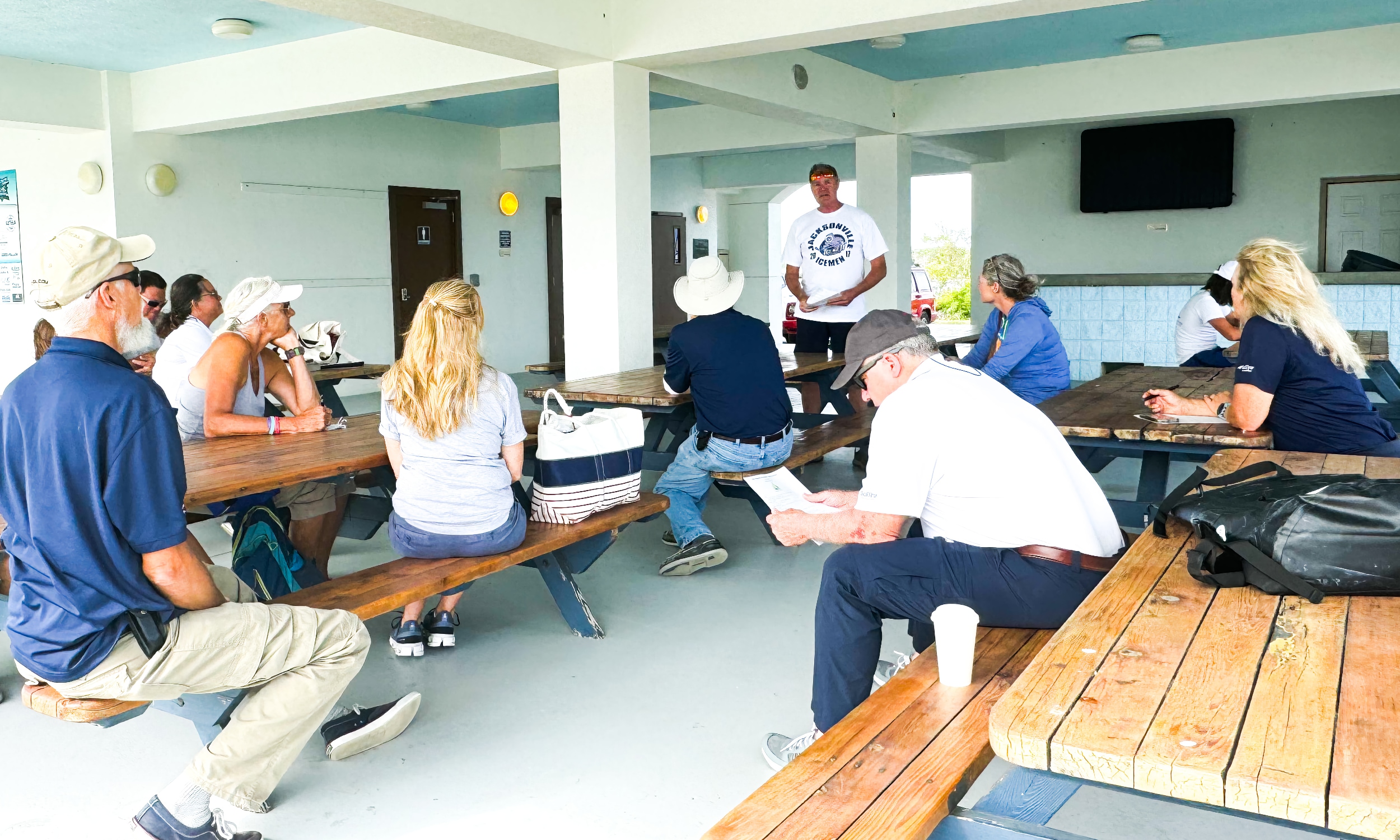 A boating expert conducts a seminar, outside in a covered area at Camachee Cove Yacth Harbor