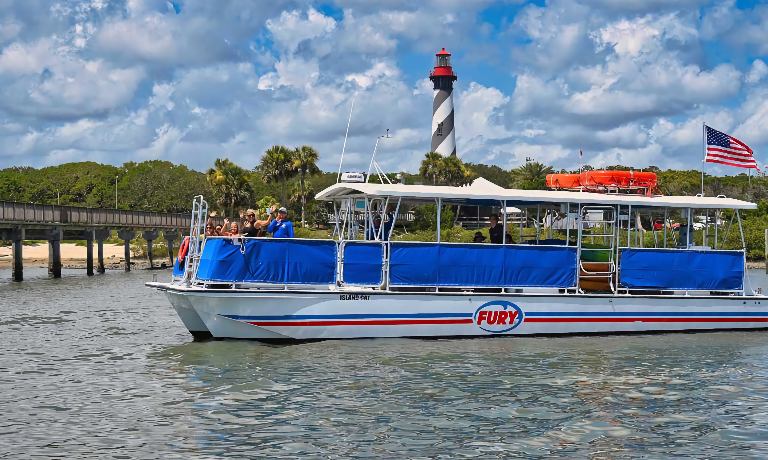 Fury power cat cruising next to St. Augustine Lighthouse