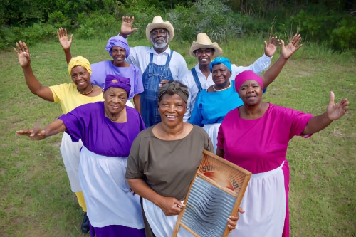 Gullah Geechee Ring Shouters waving 