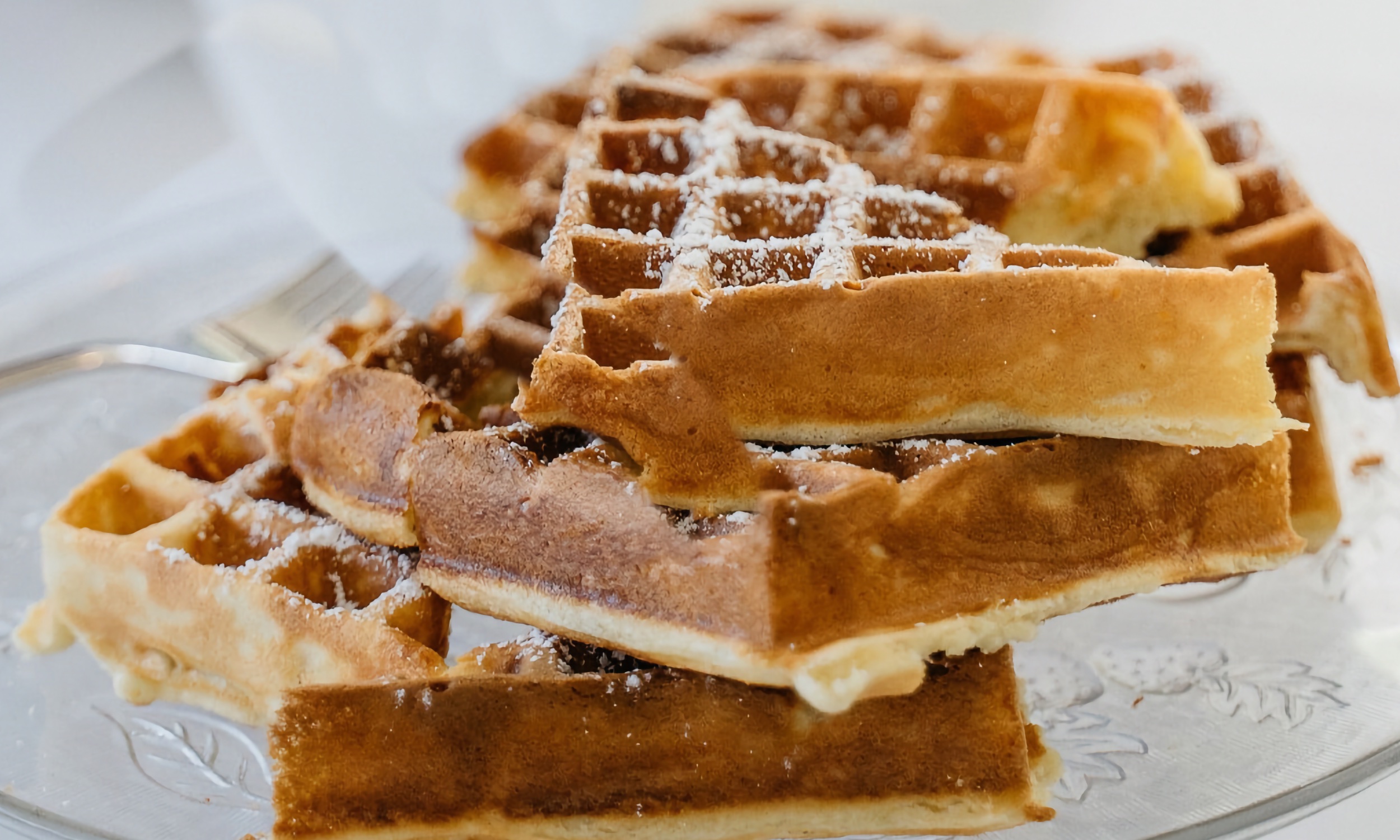A plate of waffles on a dish