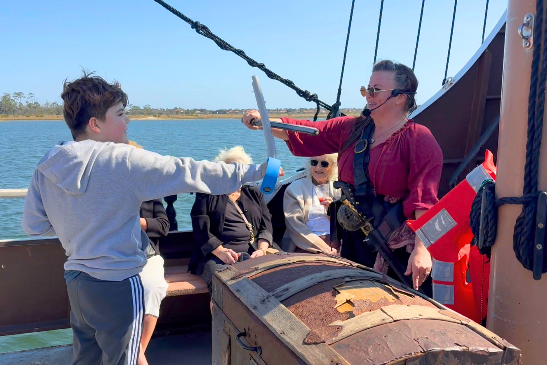 A boy wields his sword during pirate training on the Black Raven