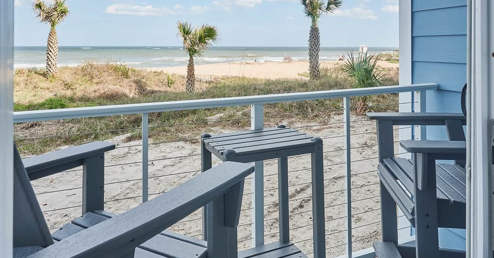 The lower-level private balcony in a room at Saint Augutine Beach House