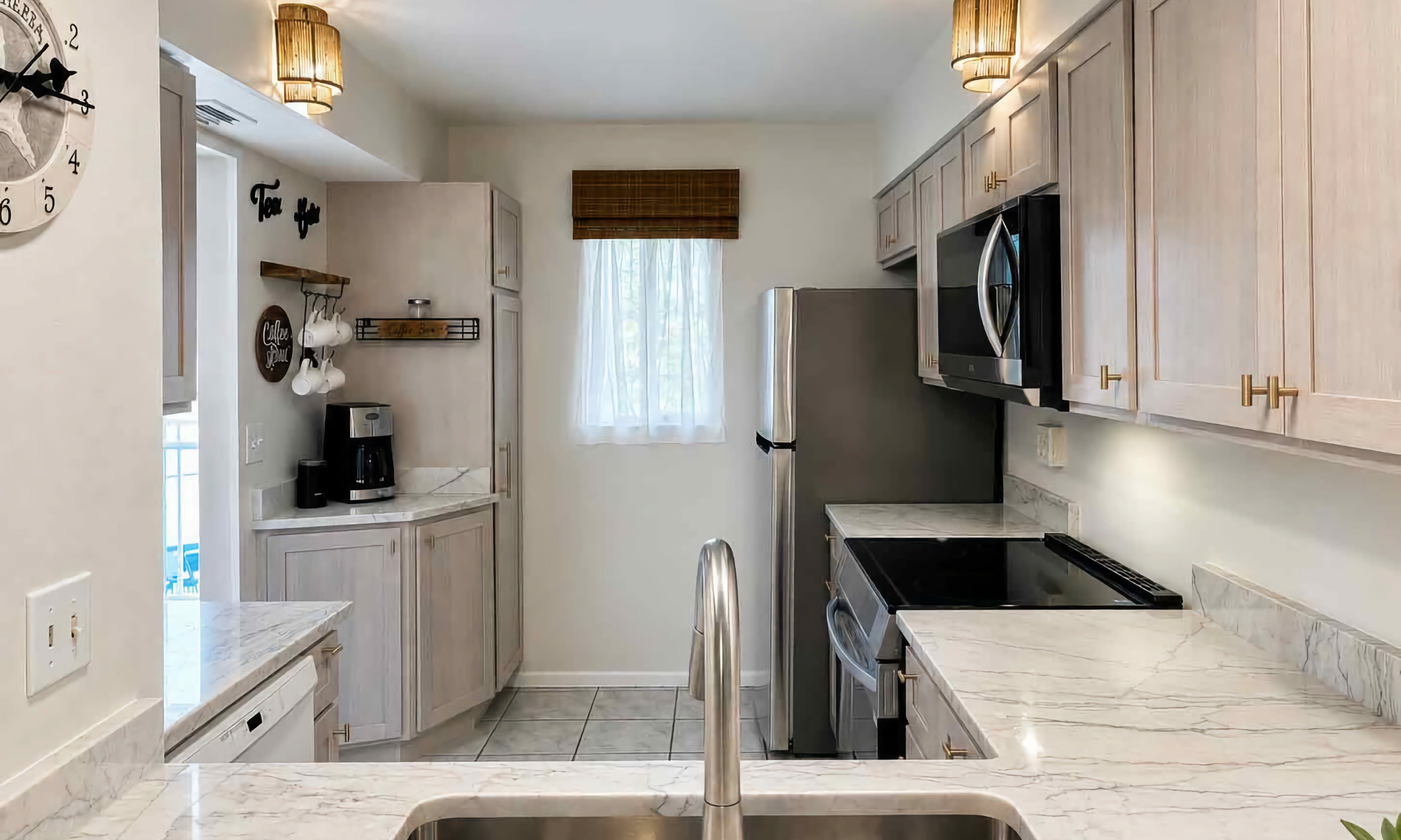 This new kitchen, as seen from the opening to the living room has a coffee station