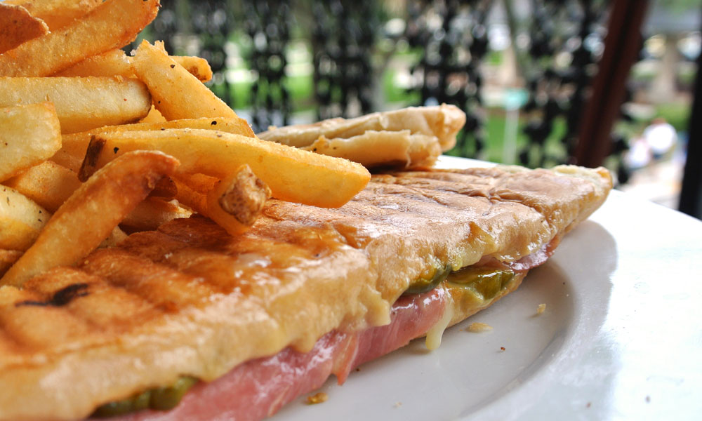 The ultimate Florida sandwich, the Cuban is made with roasted pork, ham, melted Swiss cheese, mustard, pickles, all pressed inside some warm and toasty Cuban bread.
