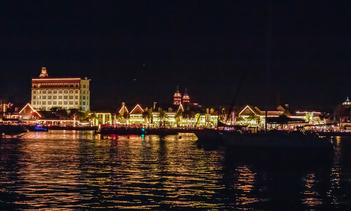 A view of St. Augustine harbor during Nights of Lights from a charter with St. Augustine Sailing.