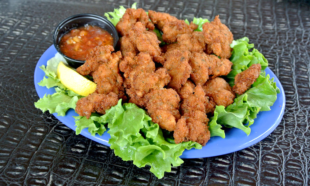 Gator tail is a popular Florida food that tastes a bit like chicken.