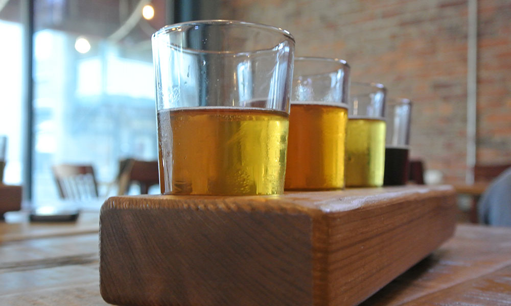 Sample Bog Brewing Company's local brews in a tasting flight. 