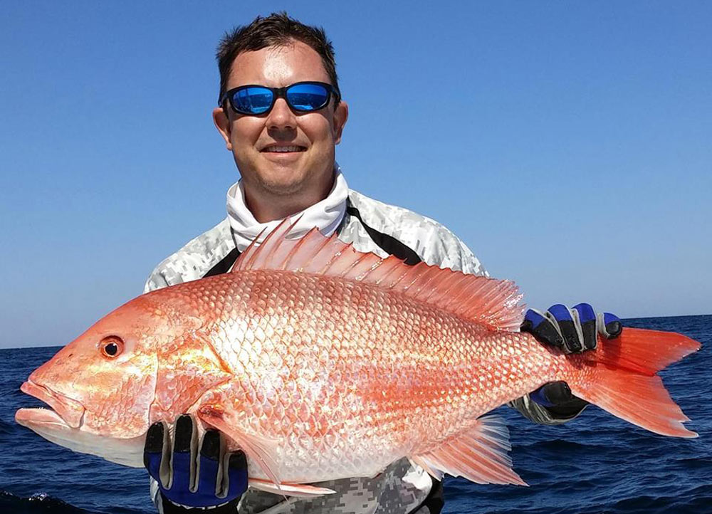 Man with snapper (photo courtesy of Rob Miller)